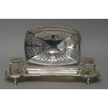 A George V silver inkstand of shaped rectangular form,