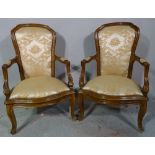 A pair of Victorian style stained beech open armchairs, on cabriole supports, (2).