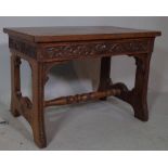 A 19th century oak occasional table/bench on trestle supports united by turned stretcher,