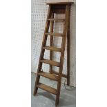 An early 20th century pine A frame ladder with six steps, 152cm tall.
