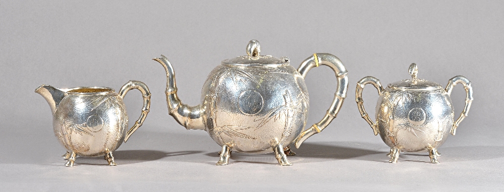 A late 19th century Chinese silver three piece tea set, Tuck Chang, Shanghai,