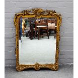 A 19th century gilt framed rectangular mirror, with floral moulded frame and bevelled plate,