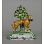 A Staffordshire pearlware figure of a lion, circa 1820,