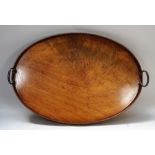 An 18th century mahogany galleried oval twin handled serving tray, 64cm wide.