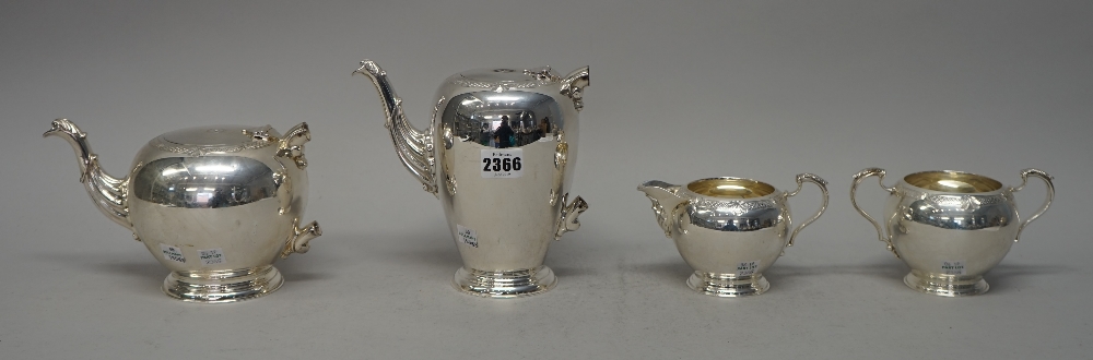 A Elizabeth II silver four piece tea set, comprising; a coffee pot, teapot,