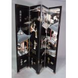 A 20th century Eastern black lacquer four fold screen decorated with Geishas in an interior,