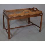 A George III mahogany butlers tray on stand, 70cm wide x 50cm high.