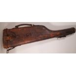 An early 20th century brown leather leg of mutton gun case, 79cm long.