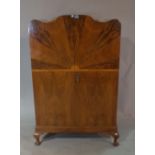 A mid-20th century walnut arch top side cabinet,