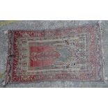 A Turkish prayer rug, 190cm x 108cm.