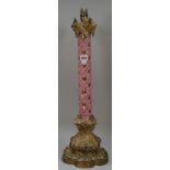 A Victorian cased glass and gilt metal mounted table lamp of column form,