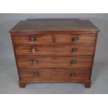 A George III mahogany chest of two short and three long graduated drawers on bracket feet,