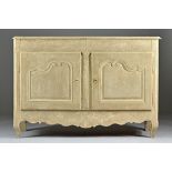 An early 19th century and later painted French two door buffet, on squat cabriole supports,