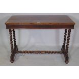 A 19th century rosewood centre table raised on barley-twist columns and 'H' frame stretcher,