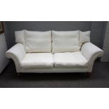 Possibly Linley; a 20th century two seat sofa with outswept arms on tapering square supports,