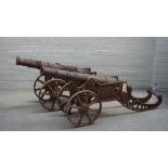 A pair of reproduction cast iron cannons, late 20th century, with circular tapering barrels,