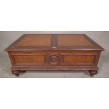 A Regency style mahogany coffee table, with tooled tan leather top over two drawers on bun feet,
