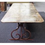 A 20th century sheet and wrought iron rectangular garden table, on trestle end supports,