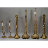 A pair of early 19th century Day's patent brass chimney ornaments of gothic form with paper trade