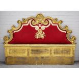 A 20th century gilt framed headboard with shell crest and scroll detail about the tapestry panel,