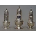 A pair of silver sugar casters, of baluster form, with pierced detachable covers,