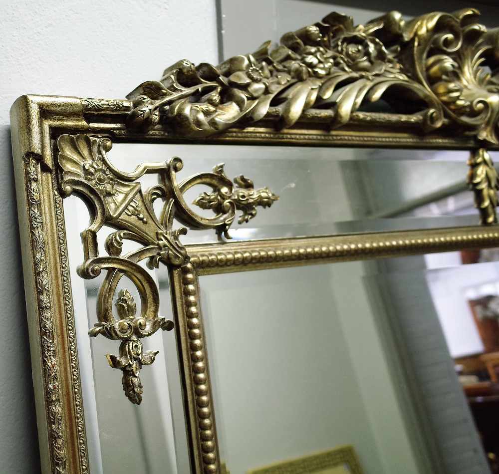 A large 20th century silver painted marginal wall mirror with carved crest and bevelled plate, - Image 2 of 3