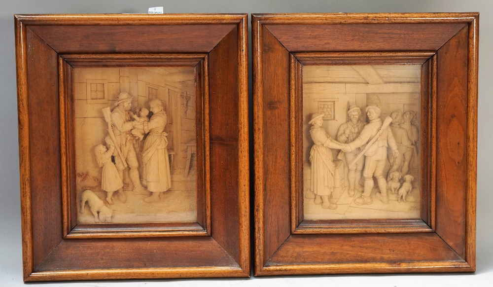 A pair of 19th century Black Forest linden/lime wood relief carved panels,