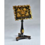 A Victorian black and gilt decorated music stand in the manner of Jennens and Bettridge,