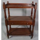 A small Victorian mahogany three tier buffet with single long drawer on baluster turned supports,