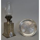 A late Victorian silver cased oil lamp base, maker's mark rubbed, Birmingham 1890, 8.