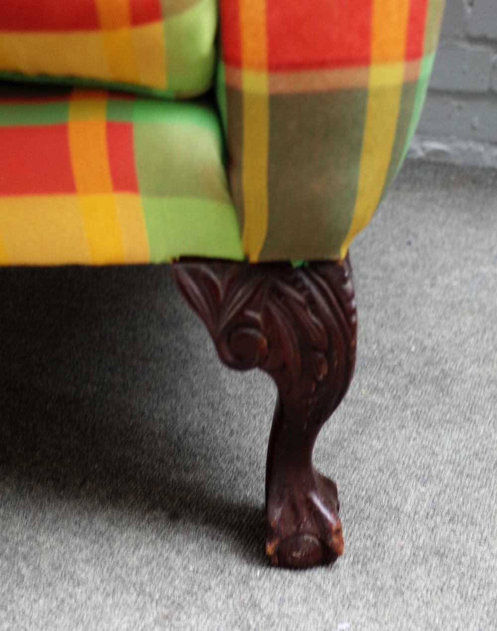 A George II style wingback armchair, on claw and ball feet, 85cm wide x 105cm high. - Image 2 of 4