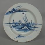 A large English delftware blue and white deep plate, probably London, circa 1770,