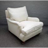 Duresta; a 20th century cream upholstered easy armchair on turned supports, 83cm wide x 76cm high.