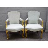 A pair of 18th century gilt framed open armchairs with serpentine seat on cabriole supports,