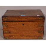 A 19th century walnut and brass bound lift top box, 30cm wide x 19cm high.