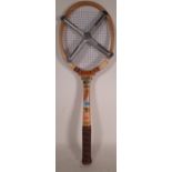 A 20th century Elverys badminton racket with stretcher.