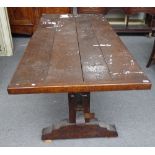 A 17th century style oak veneered plank top refectory table on trestle end standard supports,