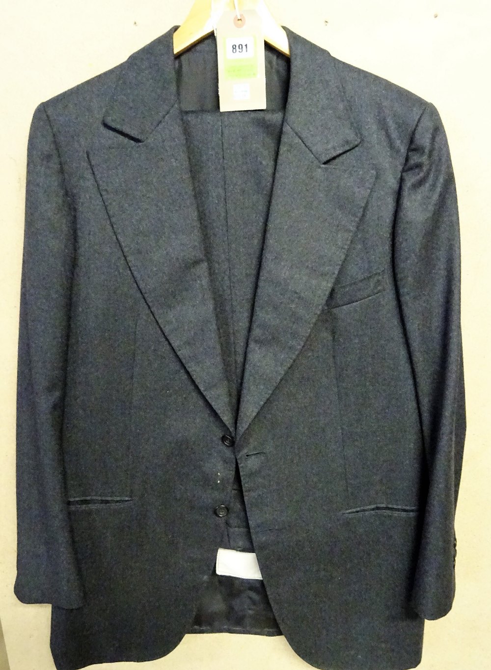 SEAN CONNERY: a bespoke dark grey single breasted wool blend suit,