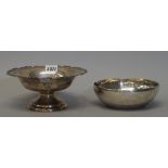A silver pedestal bowl, with a Chippendale border and raised on a circular stepped foot,