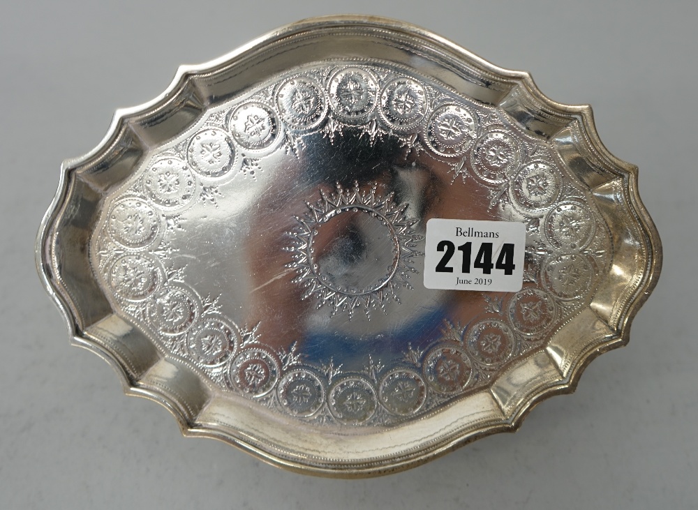 A George III silver teapot stand, of shaped oval form, with bright cut engraved decoration, - Image 2 of 7