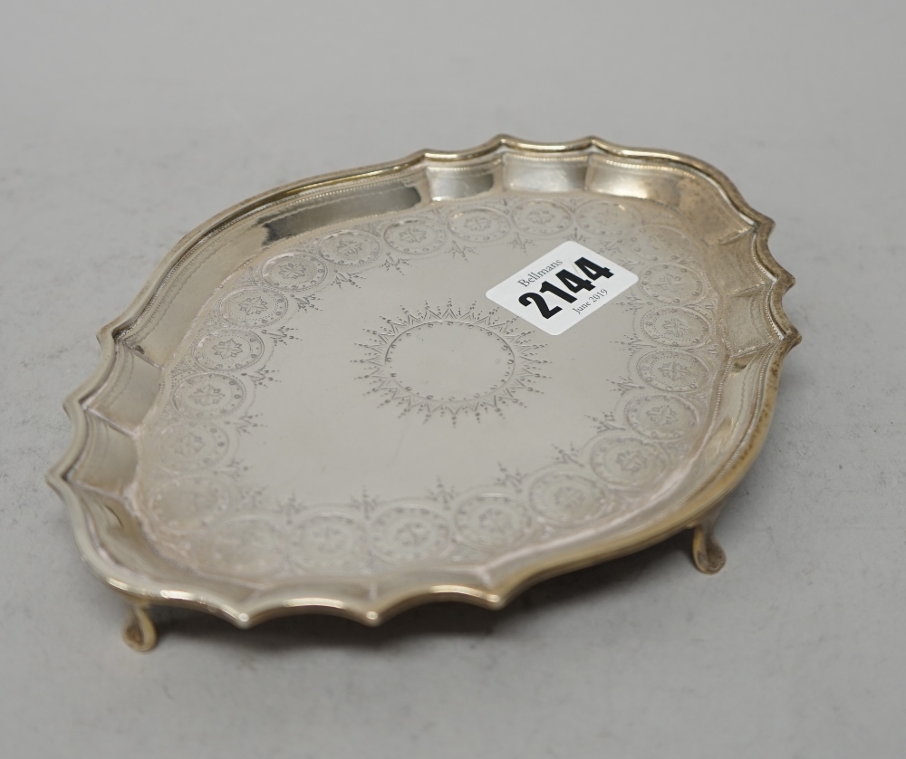 A George III silver teapot stand, of shaped oval form, with bright cut engraved decoration, - Image 5 of 7