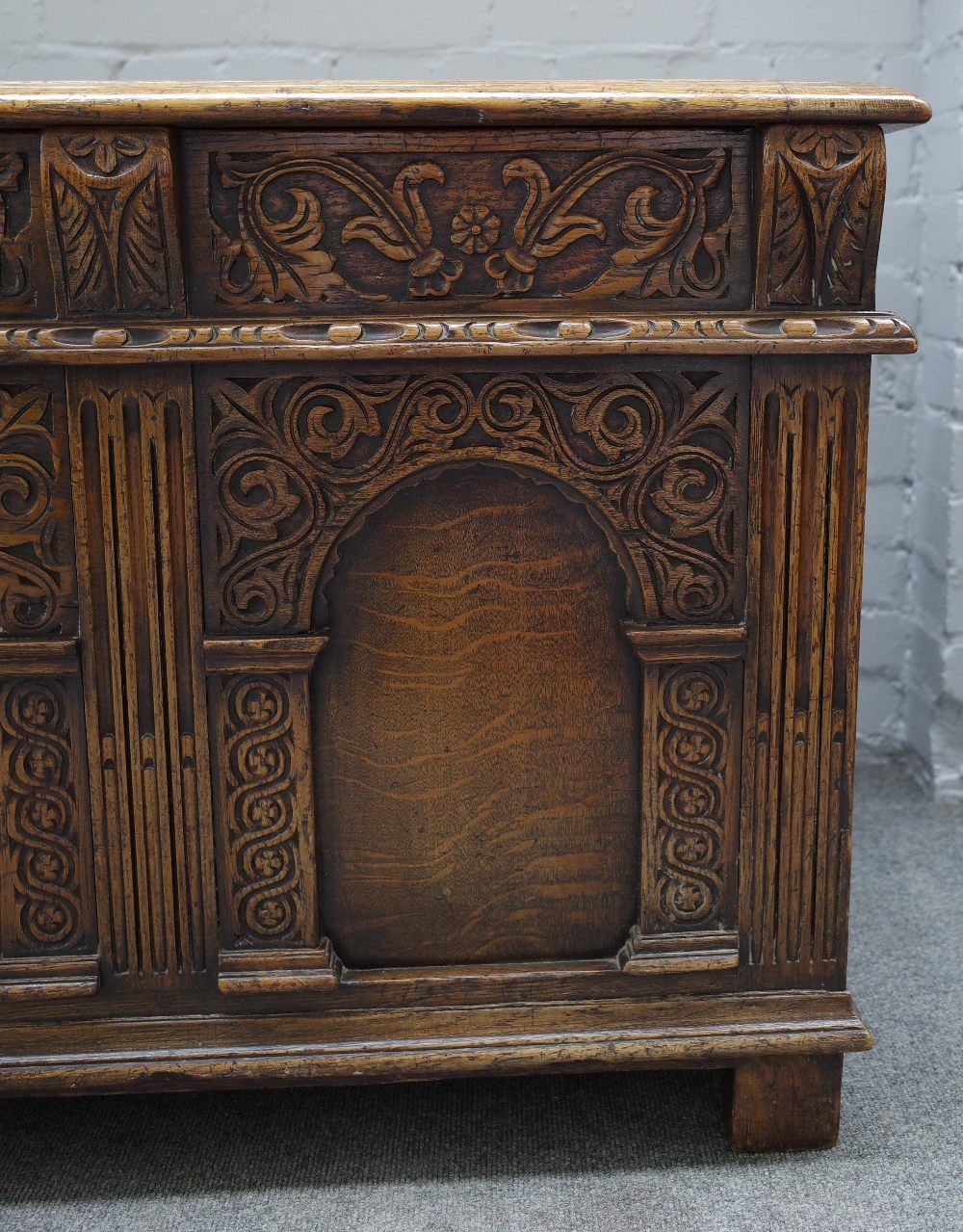 A 17th century style oak coffer, with triple panel lid and front, on stile feet, - Image 2 of 5