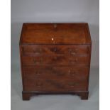 A George III mahogany bureau with four long graduated drawers, 91cm wide x 105cm high.