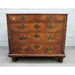 An early George III small oak chest, two short and three long drawers within blind fret angles,