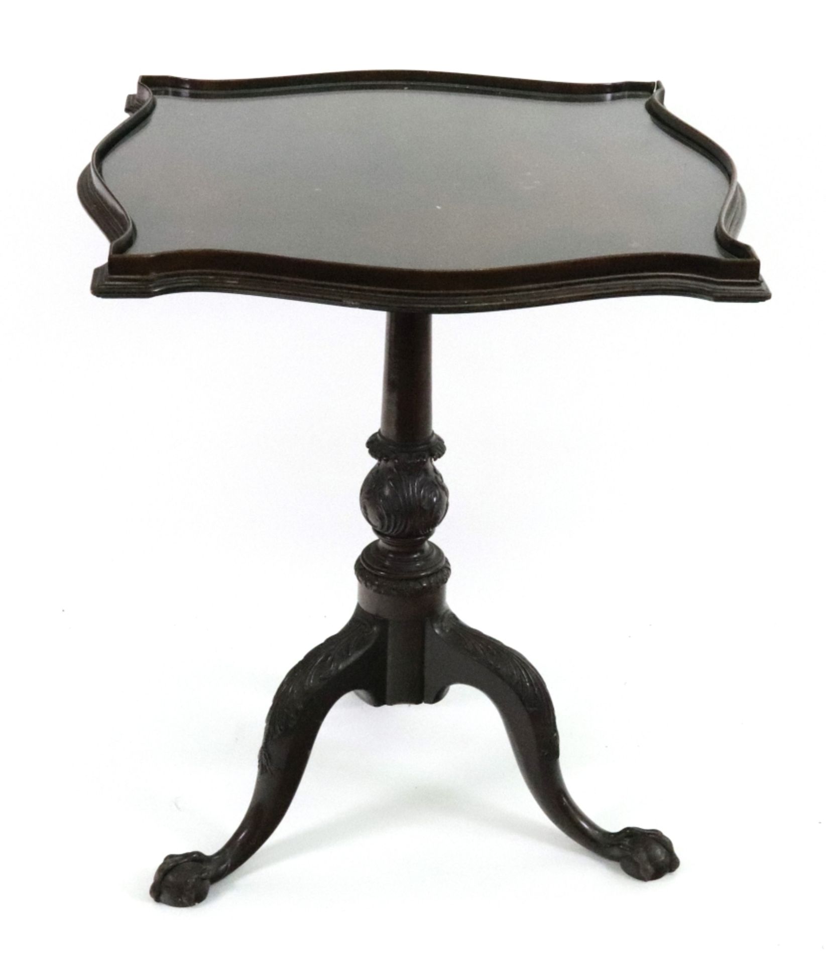 A Chippendale Revival mahogany pedestal table, the square galleried top of serpentine outline,