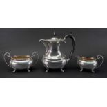 A Regency style three piece silver coffee service, J Gloster, Birmingham 1938 & 1939, of oval shape,