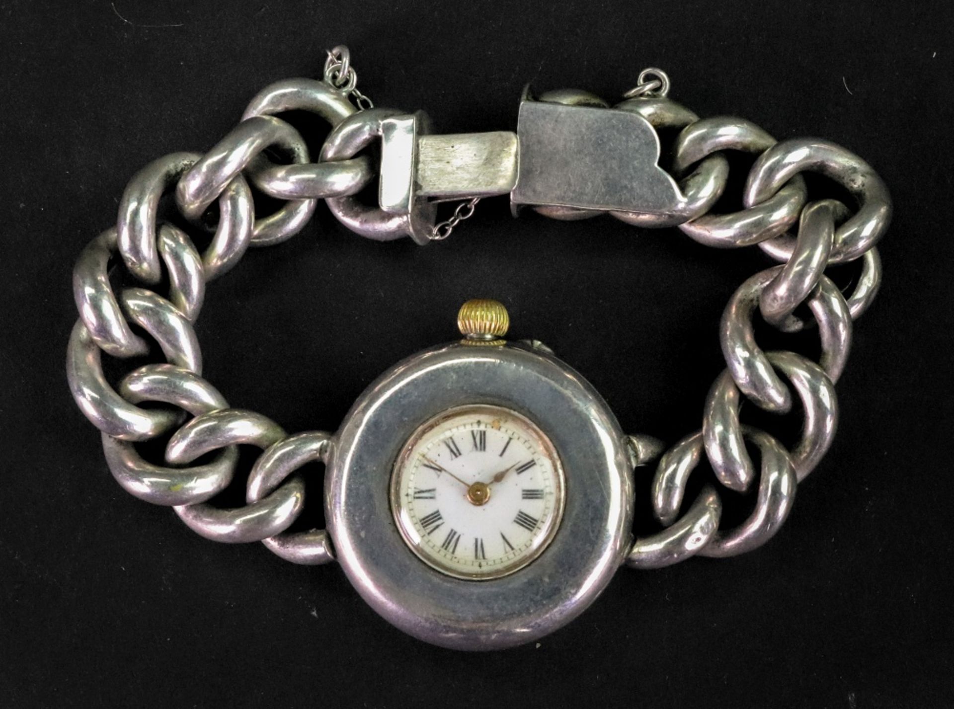 A silver cased bracelet watch, the white enamel dial with Roman numerals, the case detailed '0.