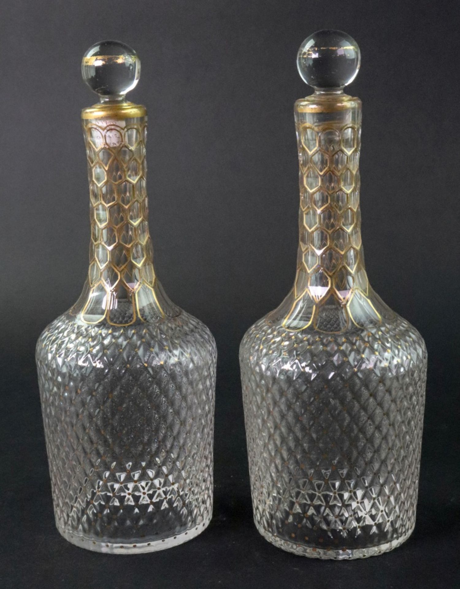 A pair of Venetian gilt decorated glass decanters, 21cm high, (2).