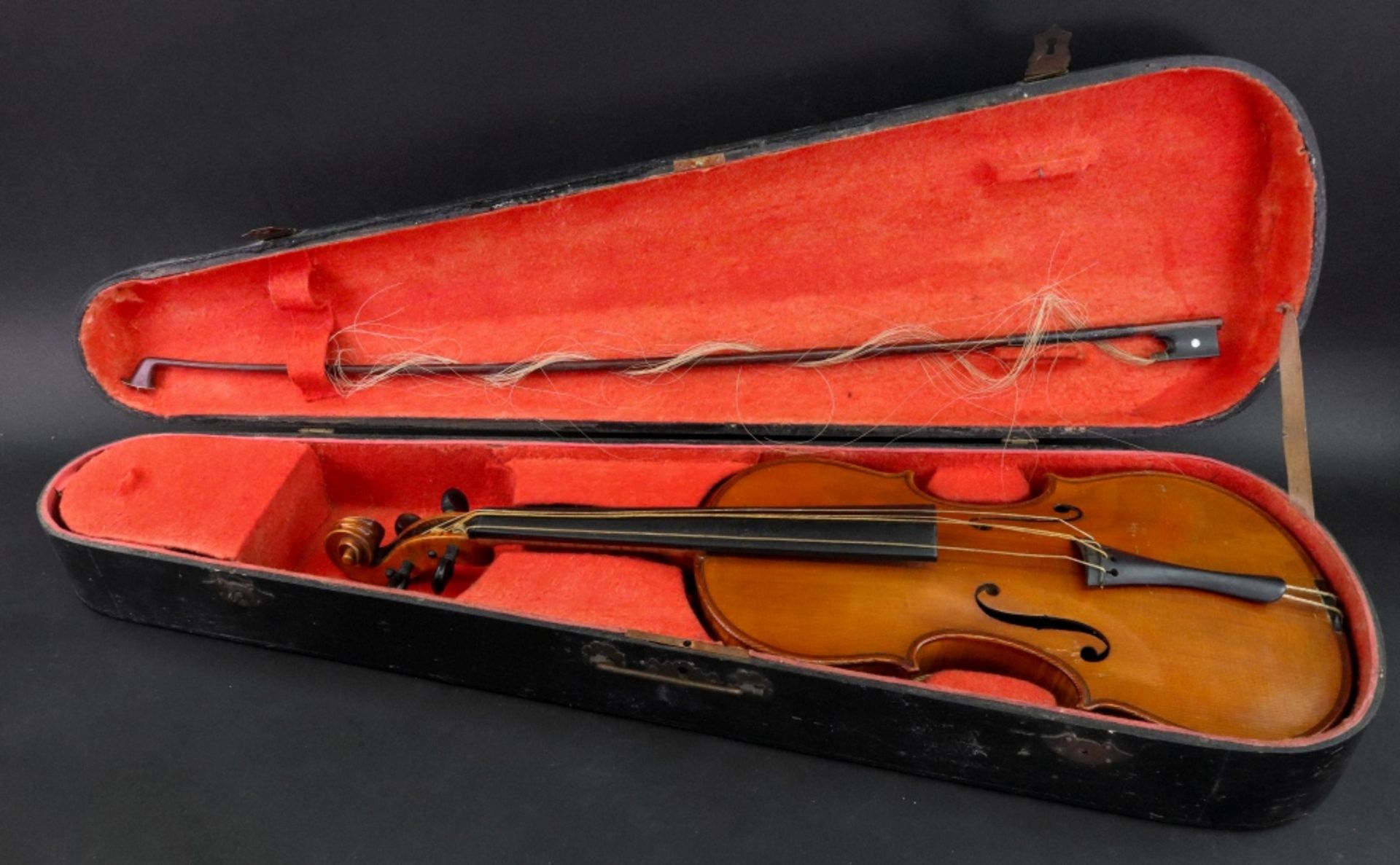 A German copy of an Italian violin, early 20th century, in well figured case, length 59cm,