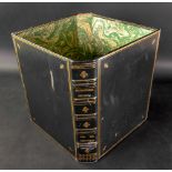 A waste bin formed from two green leather gilt tooled covers from the Encyclopaedia Britannica, 28.